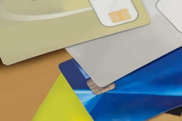 A close-up of different credit cards displayed on a table, focusing on the logos of Chase Sapphire, American Express, and Capital One. The image showcases the variety of travel reward credit cards available to consumers.