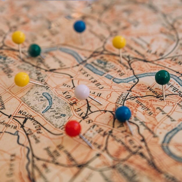 A detailed close-up of a world map with push pins marking various dream travel destinations. The map is surrounded by travel-related items such as a passport, a camera, and miniature airplane models. The lighting is warm and inviting, suggesting the excitement of planning future trips.