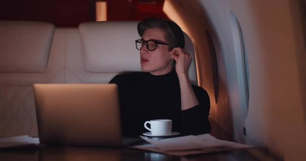 A person frustrated while looking at a laptop displaying an error message about expired airline miles. The setting is in a dimly lit room, emphasizing the disappointment and urgency of the situation.