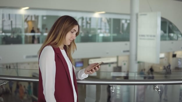 A traveler presenting their Global Entry card to a customs officer at an airport immigration checkpoint, indicating a smooth and efficient international arrival process.