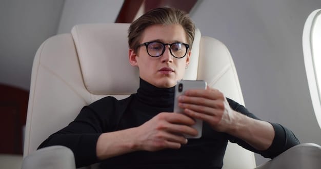 A person wearing blue light blocking glasses on a plane, looking relaxed and comfortable, indicating proactive measures to combat the effects of jet lag and minimize eye strain during travel.