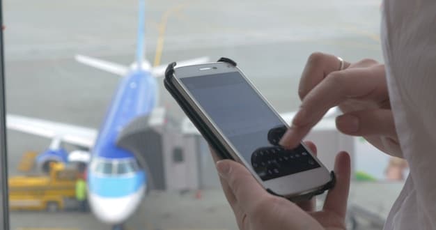 A smartphone displaying the FlightView app interface, showing real-time flight status information, including accurate gate change predictions for a specific flight number.