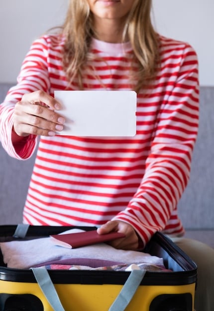 A close-up shot of a traveler filling out a baggage claim form at an airline's customer service desk. The form is partially visible, showing sections for personal information, flight details, and a description of the lost luggage. The traveler is focused and appears concerned, highlighting the seriousness of the situation.