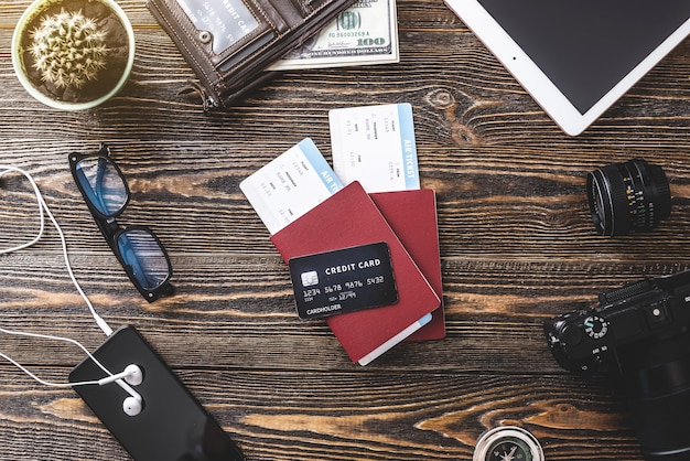 Close-up of a variety of travel rewards credit cards with different logos and colors, arranged on a sleek surface, representing the diverse options available for earning travel rewards.