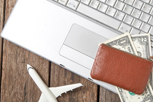 A close-up shot of a credit card with travel rewards prominently displayed, along with airplane and hotel icons in the background, illustrating the concept of earning rewards through spending.