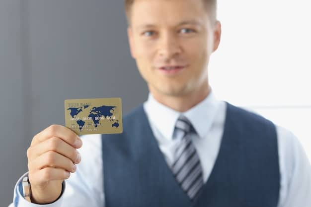 A close-up of a person holding a premium credit card with an airline logo, focusing on the card details and emphasizing its potential for unlocking airport lounge access. The background is slightly blurred but suggests an airport environment.The card represents free airport lounge access: the credit card perks you're probably not using.