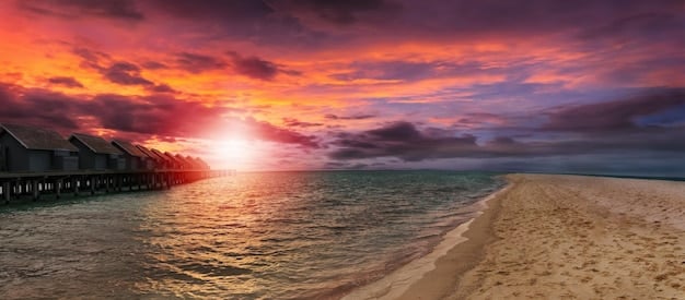 A sunset view of a Caribbean beach during the off-season, featuring calm waters, empty beach chairs, and a relaxed atmosphere. This image conveys the serenity and cost-effectiveness of Off-Season Travel: Save Up to 40% by Traveling During Shoulder Seasons.